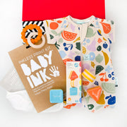 Welcome a new baby with this thoughtful selection of gifts - included is the ergoPouch organic short sleeve romper which is perfect for bedtime or in the day when comfort and practicality is needed. For the nappy bag is a two pack of bamboo muslin bandana bibs and a silicone and wood teething toy.&nbsp; The Tiger Tribe Eco Shape Shakers will keep little one happy and are the perfect size for tiny hands to hold.&nbsp; To make sure those little hands are captured forever we have also included the no mess Baby